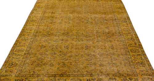 Load image 1 in gallery view. Mustard yellow vintage-style rug with a faded floral medallion pattern and a detailed border on a white background.