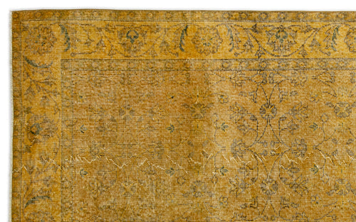 Load image 1 in gallery view. Mustard yellow vintage-style rug with a faded floral medallion pattern and a decorative border.