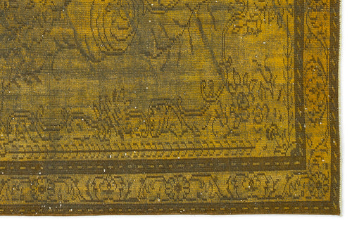 Load image 1 in gallery view. Mustard yellow and dark brown vintage-style rug with a distressed floral medallion pattern and a decorative border.