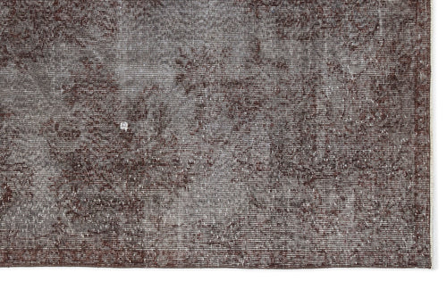Load image 1 in gallery view. Dark brown and grey distressed rug with a faded, textured vintage pattern.