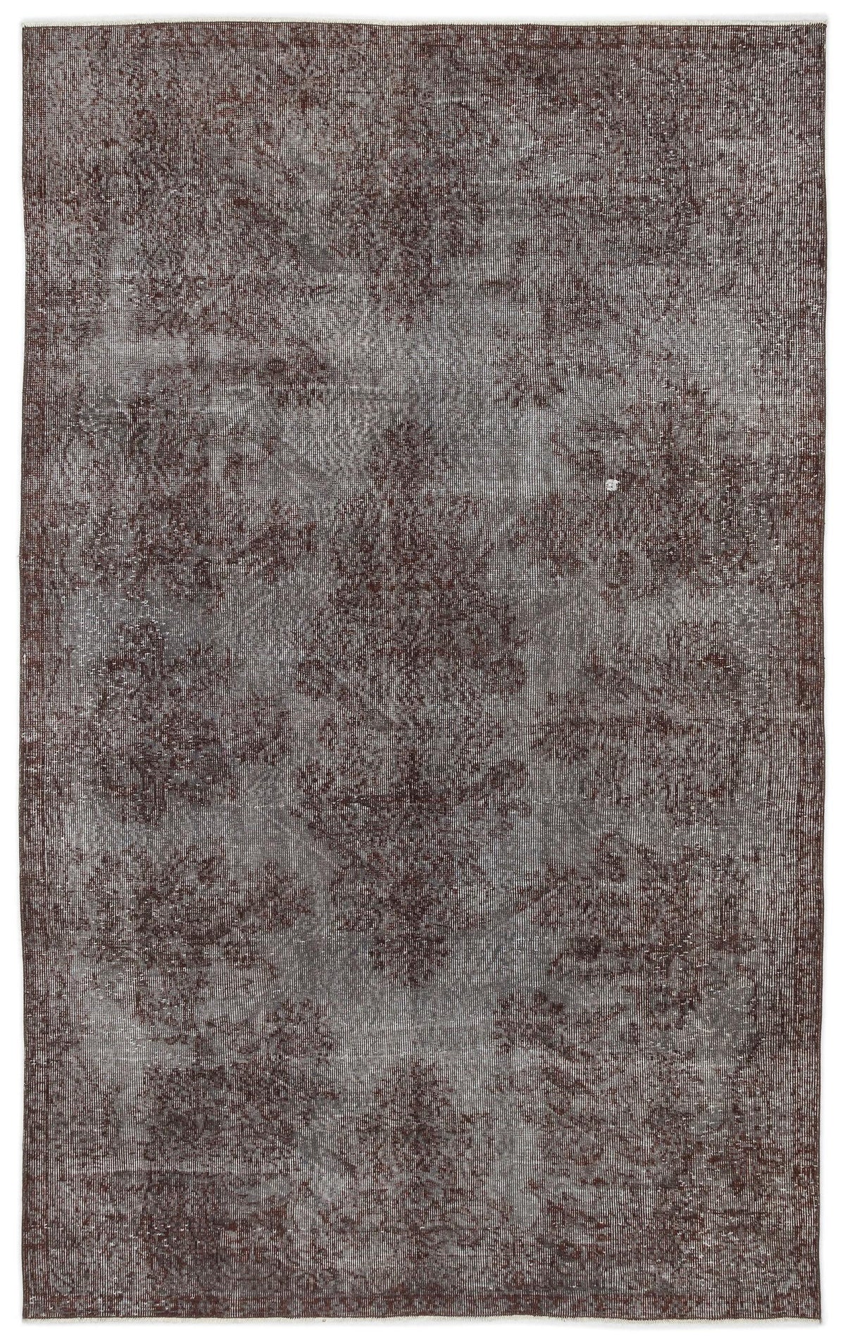 Dark brown and grey distressed rug with a faded traditional medallion pattern on a white background.