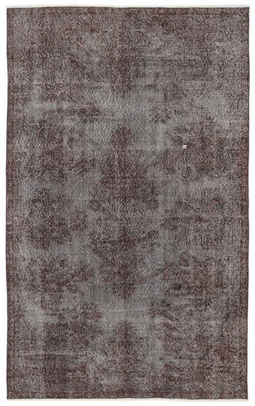Load image 1 in gallery view. Dark brown and grey distressed rug with a faded traditional medallion pattern on a white background.