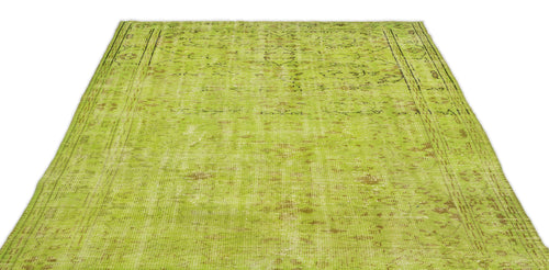 Load image 1 in gallery view. Chartreuse distressed vintage-style rug with a faded traditional medallion pattern and a bordered edge.