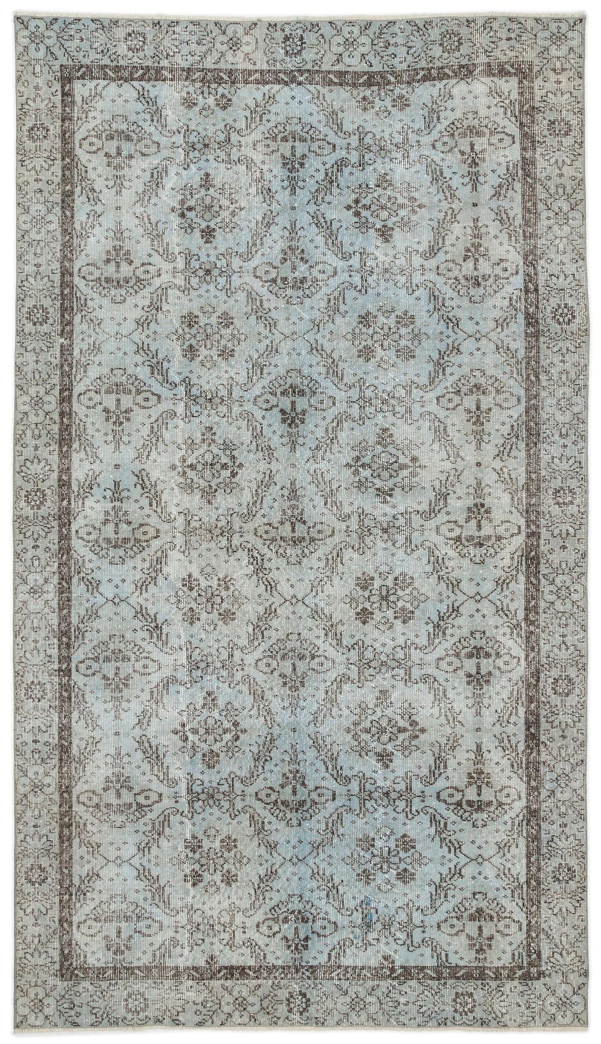 Light blue and charcoal grey traditional rug with a distressed floral medallion pattern and a decorative border.