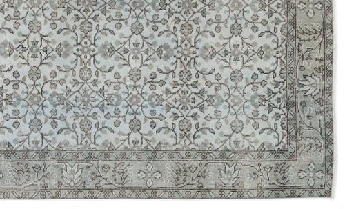 Load image 1 in gallery view. Light blue and grey traditional rug with a distressed floral medallion pattern and a decorative border.