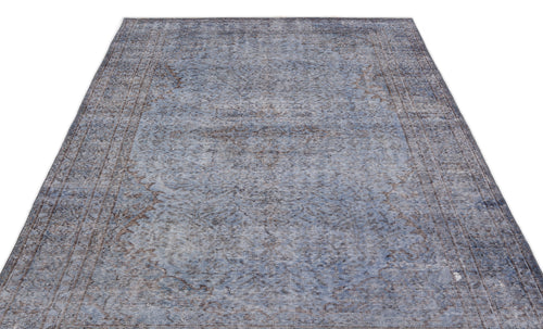 Load image 1 in gallery view. Blue and grey distressed vintage-style rug with a faded traditional floral pattern on a white background.