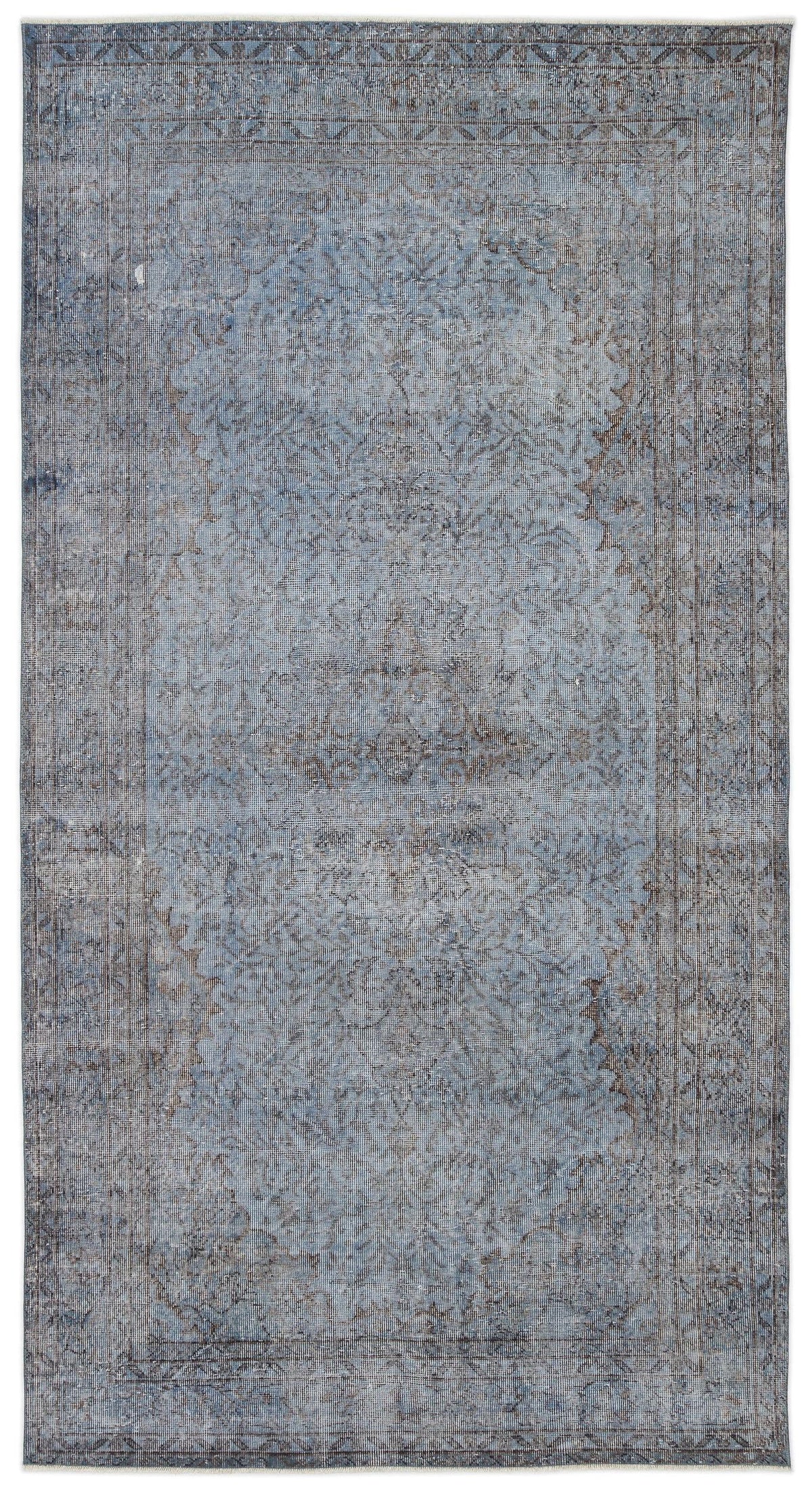 Blue and grey distressed vintage-style rug with a central medallion and ornate border pattern.