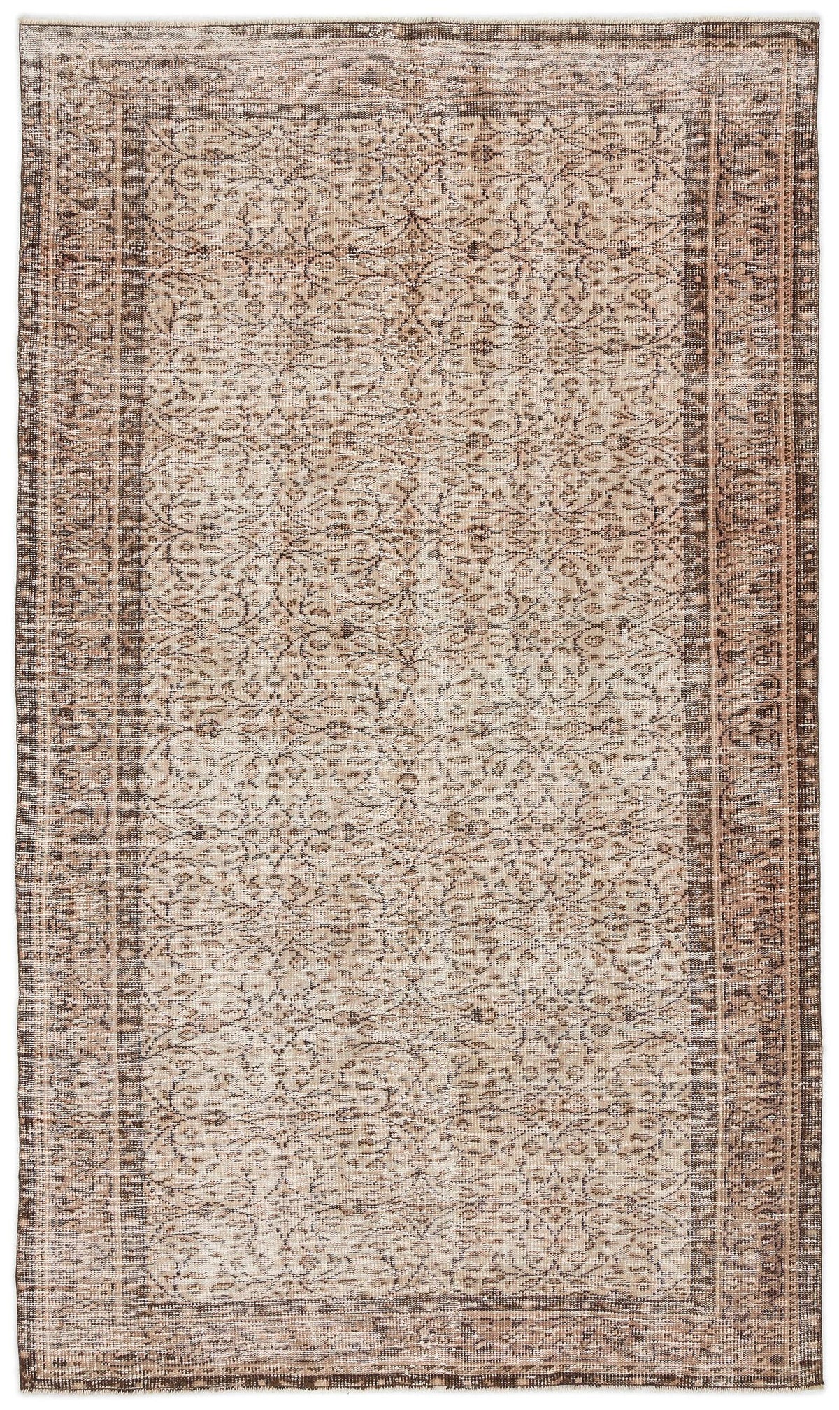Beige and brown distressed rug with a traditional floral medallion pattern and a wide decorative border.