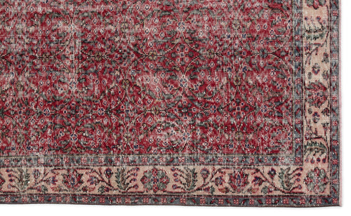 Load image 1 in gallery view. Distressed red and cream traditional rug with a dense floral medallion pattern and a wide decorative border.