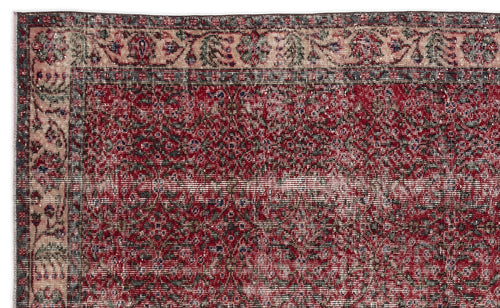 Load image 1 in gallery view. Distressed red and charcoal traditional rug with a floral medallion pattern and a decorative border.