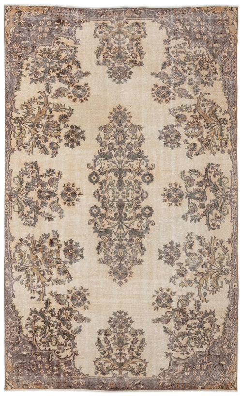 Load image 1 in gallery view. The Detiar Vintage Medallion Rug (5'9" x 9'5") features a beige background with symmetrical floral and leafy patterns in brown and gray, accented by a detailed decorative border.
