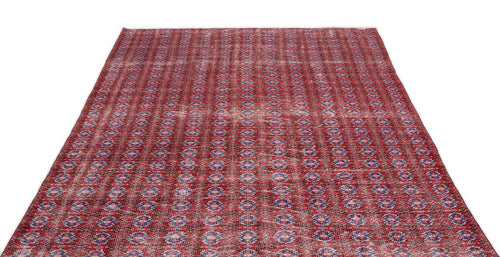 Load image 1 in gallery view. Red and blue distressed rug with a repeating geometric medallion pattern on a white background.