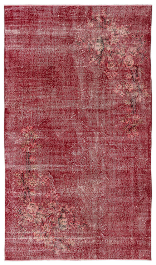 Load image 1 in gallery view. Distressed deep red rug with an asymmetrical floral branch pattern in muted pink and beige tones.