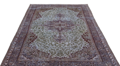 Load image 1 in gallery view. Distressed vintage-style rug with a central medallion and floral motifs in muted burgundy, olive green, and cream.