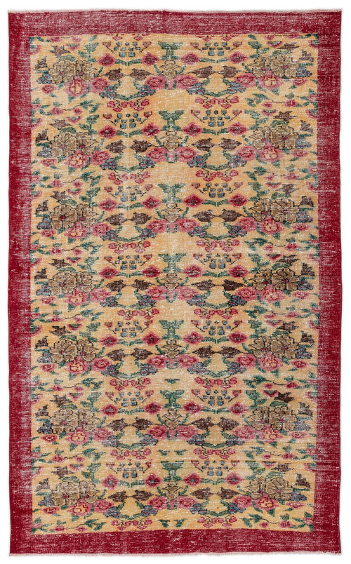 Load image 1 in gallery view. Distressed gold rug with a red border and repeating floral medallion pattern in pink, green, and brown.
