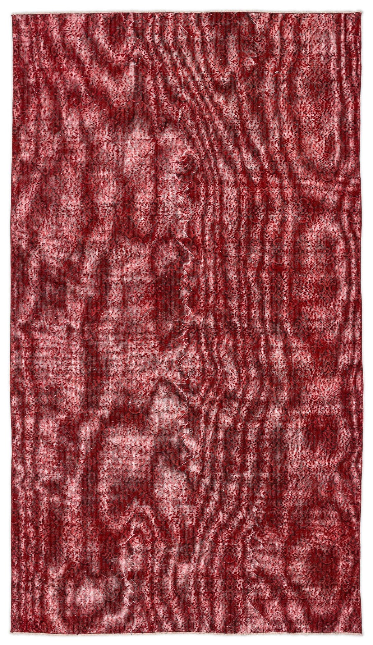 Deep red distressed rug with a faint, tonal geometric diamond pattern.