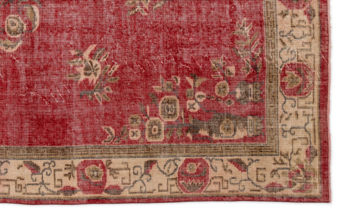 Load image 1 in gallery view. Red rug with a distressed floral pattern and a beige geometric border.