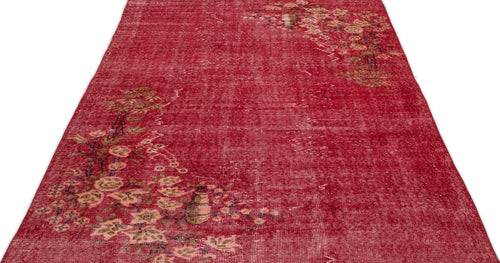 Load image 1 in gallery view. Distressed red rug with a faded floral branch pattern in beige and brown, isolated on a white background.