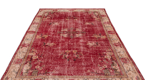 Load image 1 in gallery view. Distressed red and beige traditional rug with a central floral medallion and ornate border pattern.