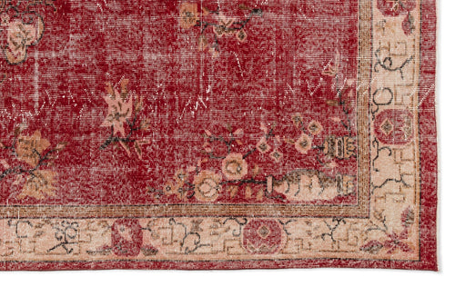 Load image 1 in gallery view. Distressed red rug with a faded floral pattern and a cream-colored border featuring geometric and botanical motifs.