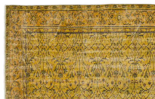 Load image 1 in gallery view. Mustard yellow vintage-style rug with a dark brown geometric lattice and floral motif, featuring a distressed finish.