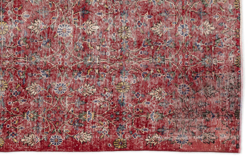 Load image 1 in gallery view. Distressed red rug with a faded floral medallion pattern in blue, cream, and yellow on a white background.