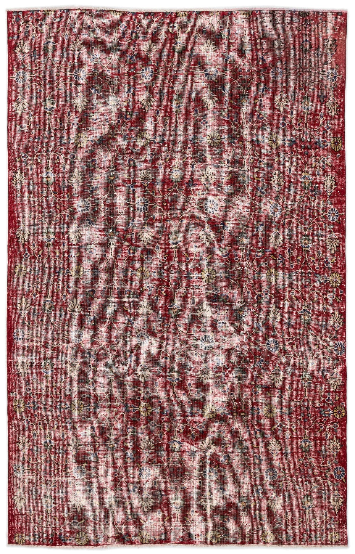 Distressed red vintage-style rug with an all-over faded floral pattern in cream, blue, and yellow accents.