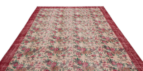 Load image 1 in gallery view. Distressed beige rug with a red floral pattern and a wide red border on a white background.