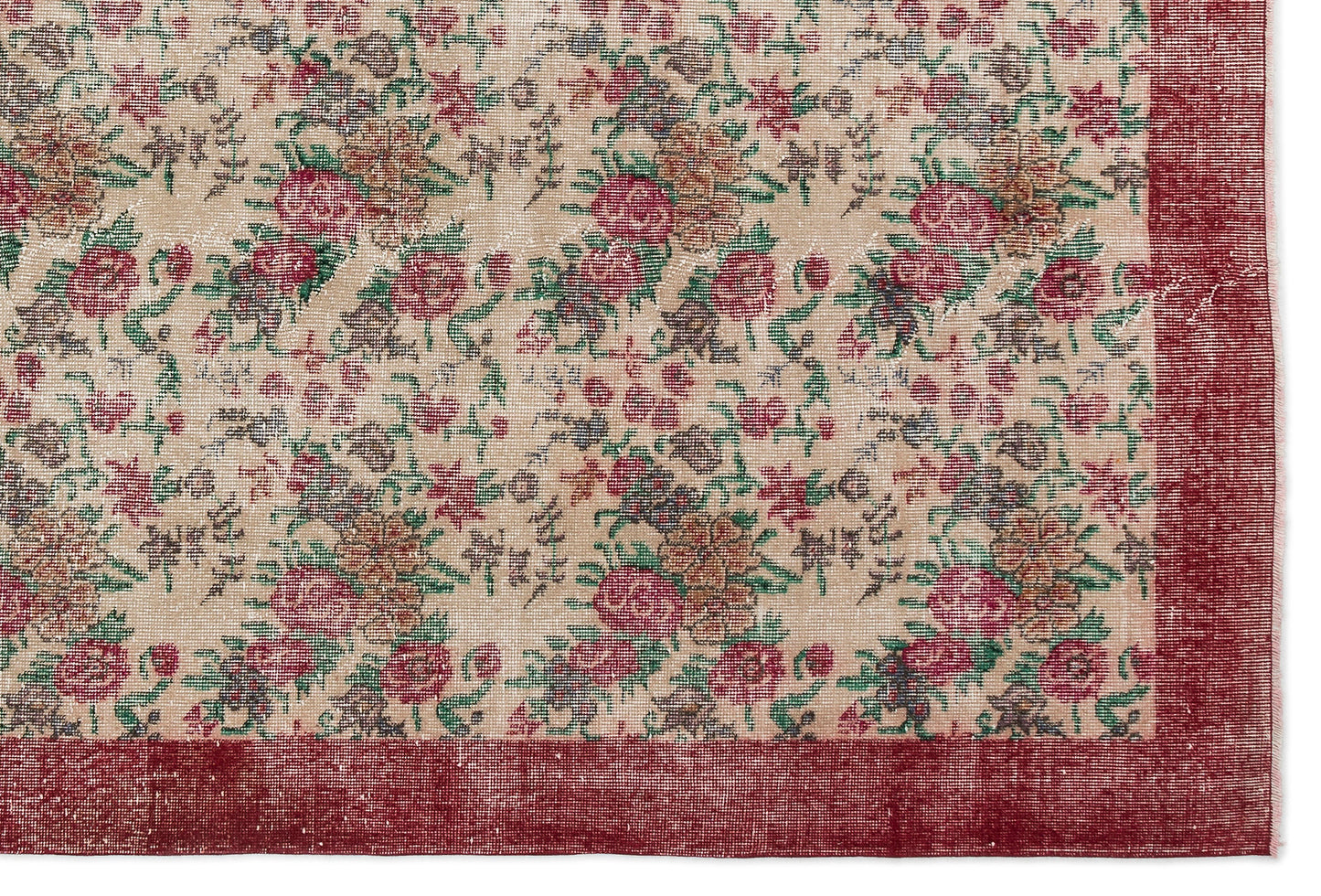 Beige rug with a distressed floral pattern in red, green, and brown, featuring a solid red border.