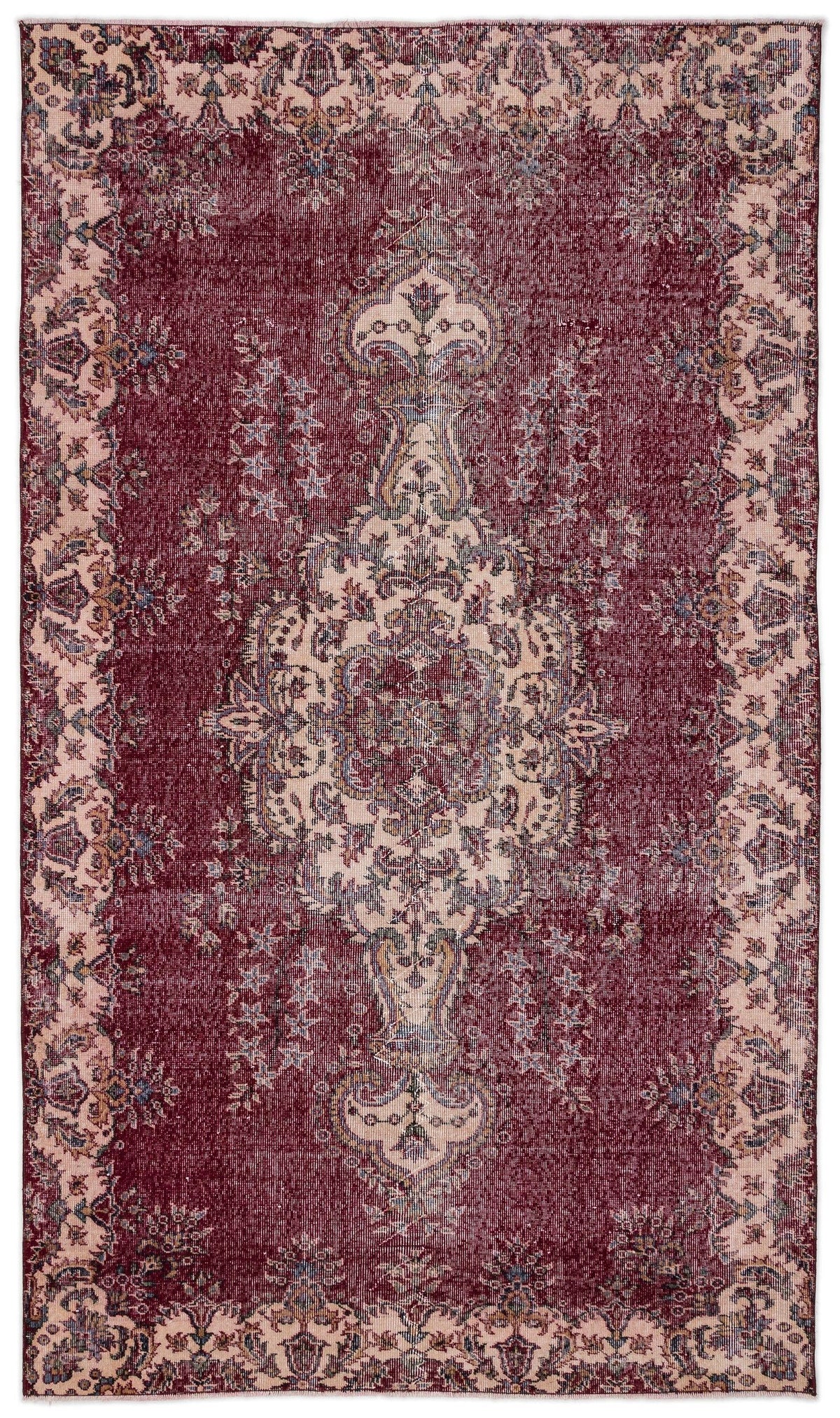 Deep red and cream vintage-style rug with a central floral medallion and ornate border on a white background.