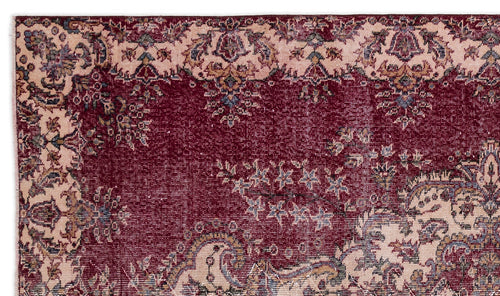 Load image 1 in gallery view. Deep red and cream traditional rug with an intricate floral medallion pattern and distressed texture.