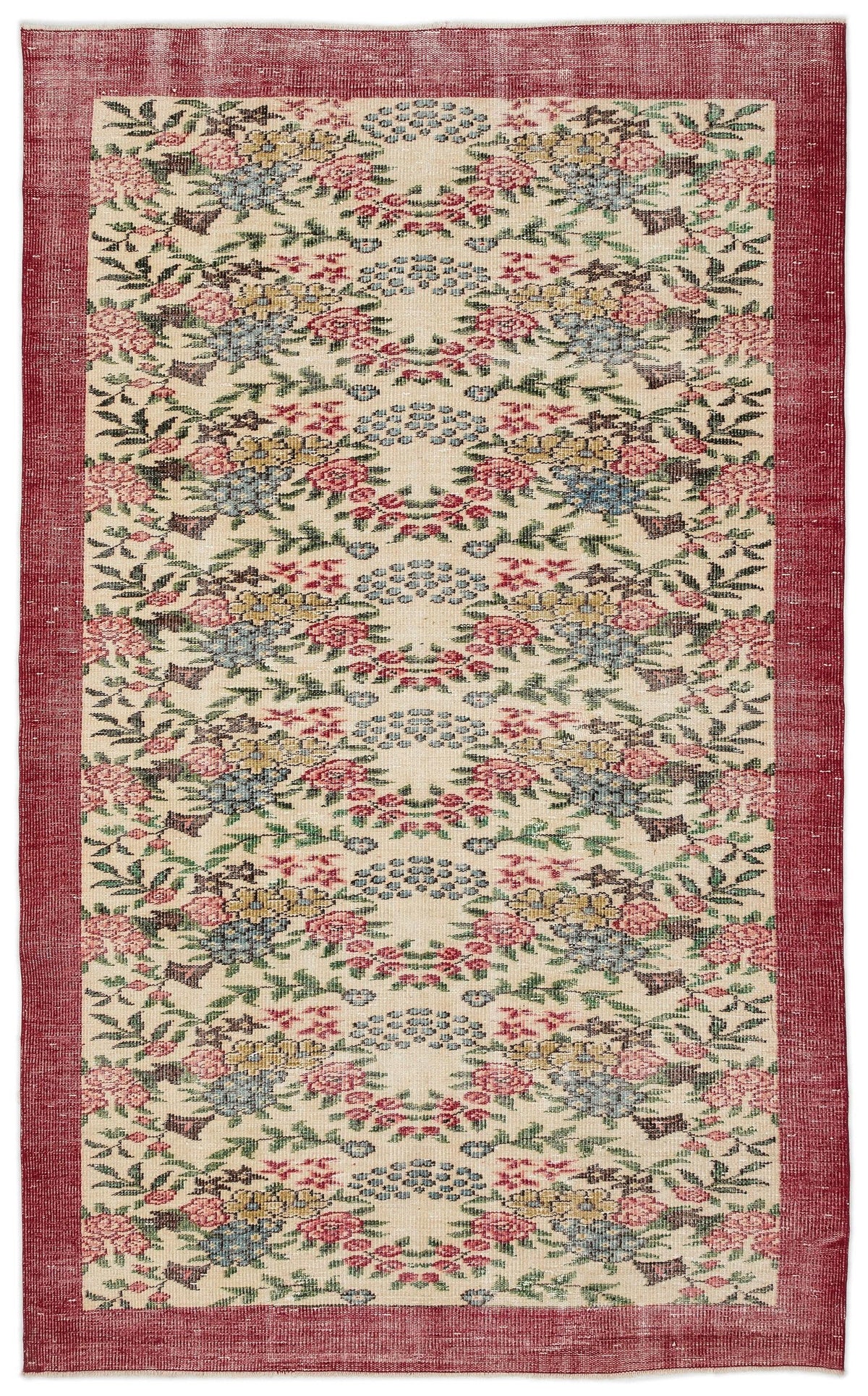 Cream rug with a red border and a repeating floral pattern in red, blue, yellow, and green.