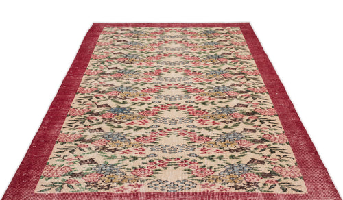Load image 1 in gallery view. Cream rug with a red border and a repeating floral pattern in red, blue, and green on a white background.