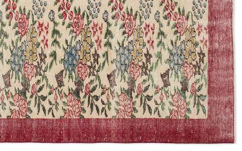 Load image 1 in gallery view. Cream rug with a multi-colored floral pattern and a solid red border.
