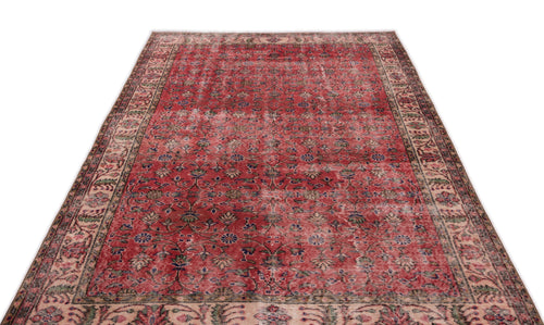 Load image 1 in gallery view. Distressed red Persian-style rug with a floral vine pattern and a wide, intricate border on a white background.