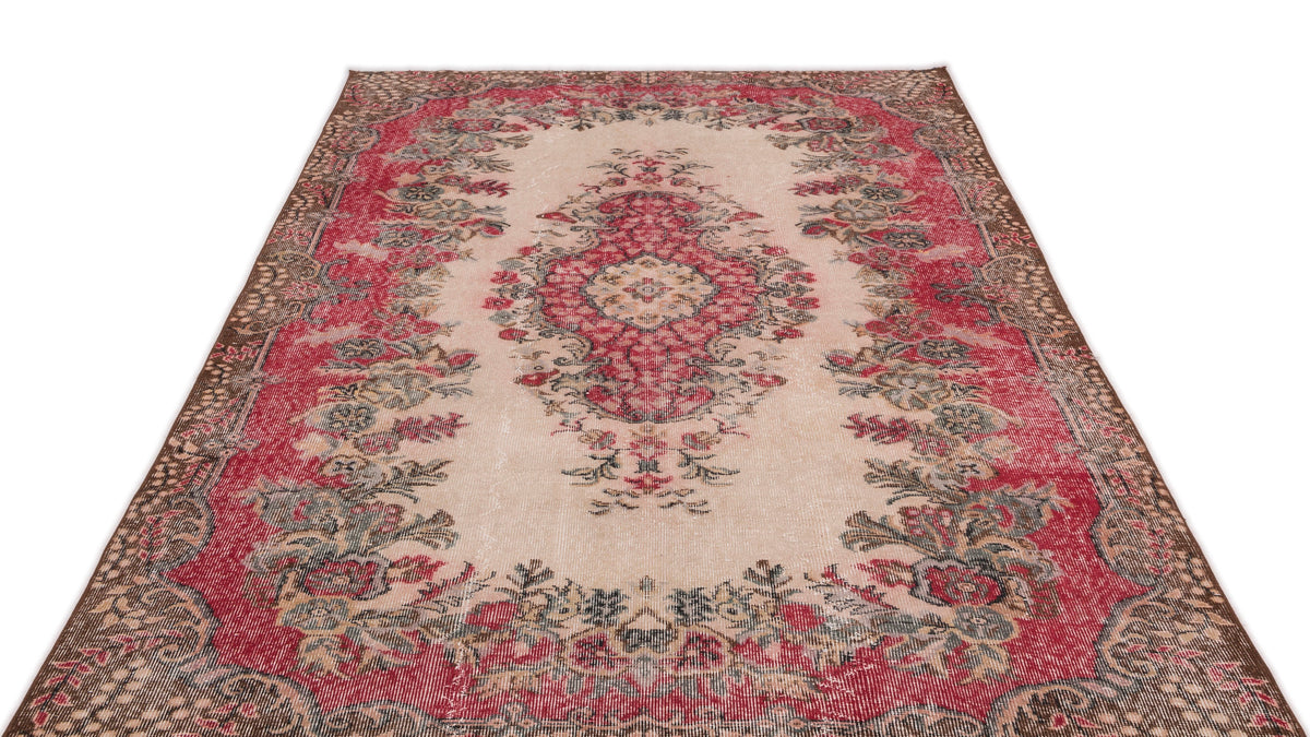 Distressed cream and red vintage-style rug with a central floral medallion and ornate border on a white background.