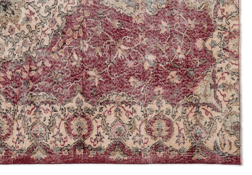 Load image 1 in gallery view. Distressed traditional rug with a deep red field and cream floral medallion border.
