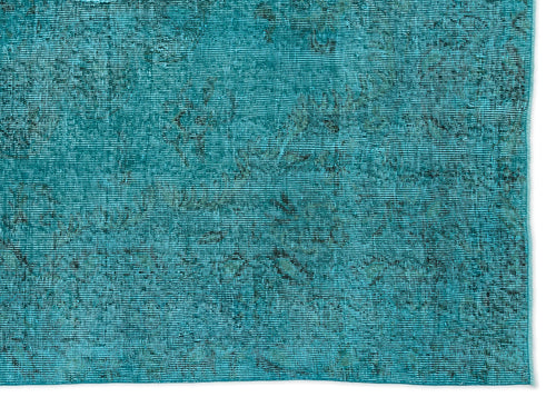 Load image 1 in gallery view. Teal rug with a distressed, faded traditional pattern and visible woven texture on a white background.
