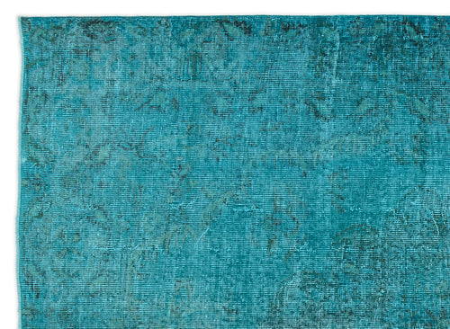 Load image 1 in gallery view. Teal distressed overdyed rug with a faint, worn traditional medallion pattern.