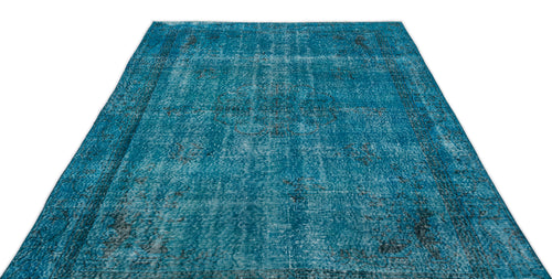 Load image 1 in gallery view. Teal distressed area rug with a faded central medallion and traditional border pattern on a white background.