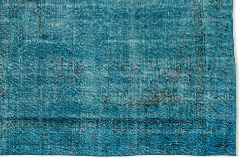 Load image 1 in gallery view. Teal distressed rug with a faded black traditional floral border and medallion pattern.