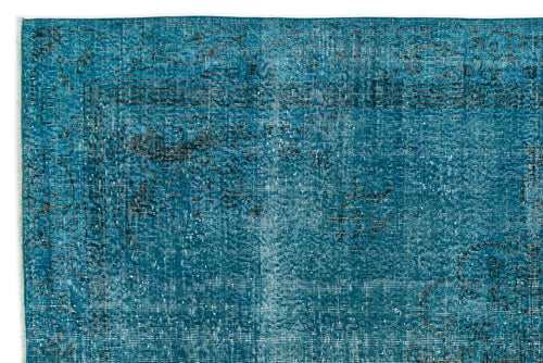 Load image 1 in gallery view. Teal distressed rug with a faded black traditional border and floral motif.