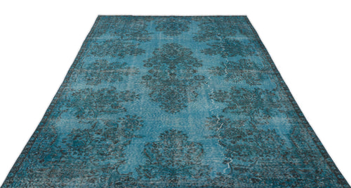 Load image 1 in gallery view. Distressed turquoise and charcoal rug with a repeating traditional floral medallion pattern.
