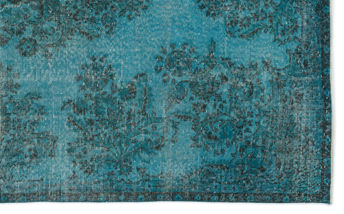 Load image 1 in gallery view. Teal and black distressed rug with an ornate floral medallion pattern and a dark decorative border.