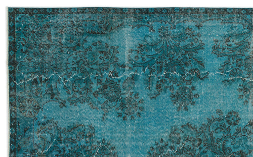 Load image 1 in gallery view. Teal and black distressed rug with a traditional floral medallion pattern and a dark border.