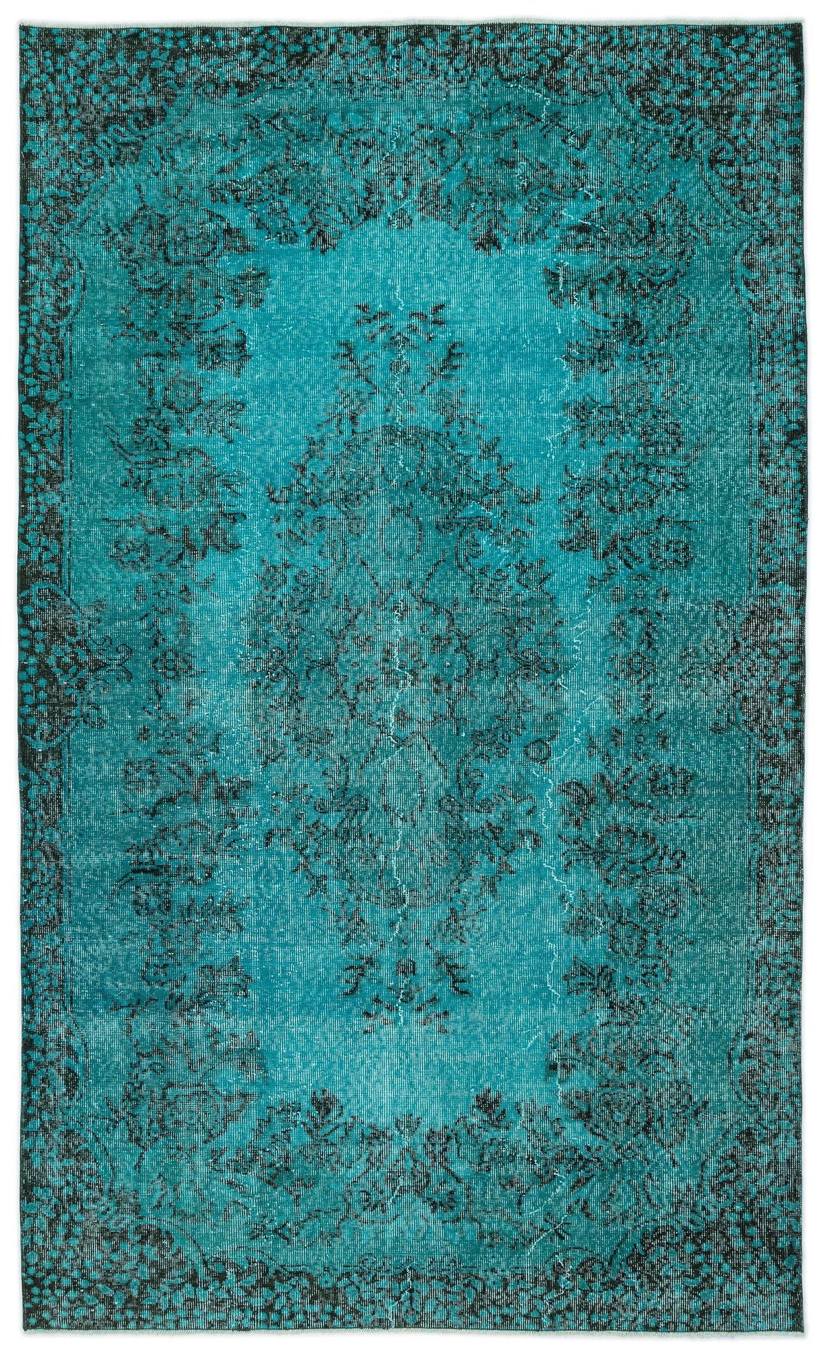 Teal and black distressed vintage-style rug with a central floral medallion and ornate border.