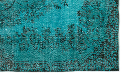 Load image 1 in gallery view. Teal and black distressed rug with a traditional floral medallion pattern.
