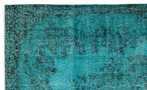 Load image 1 in gallery view. Teal and black rug with a distressed, traditional floral medallion pattern.