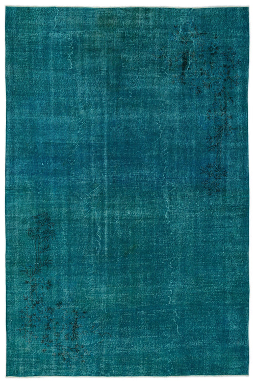 Load image 1 in gallery view. Teal distressed rug with a faded, monochromatic finish and subtle black floral motifs in opposite corners.
