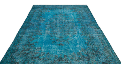Load image 1 in gallery view. Distressed turquoise and black traditional medallion rug with a faded, vintage-style floral pattern.